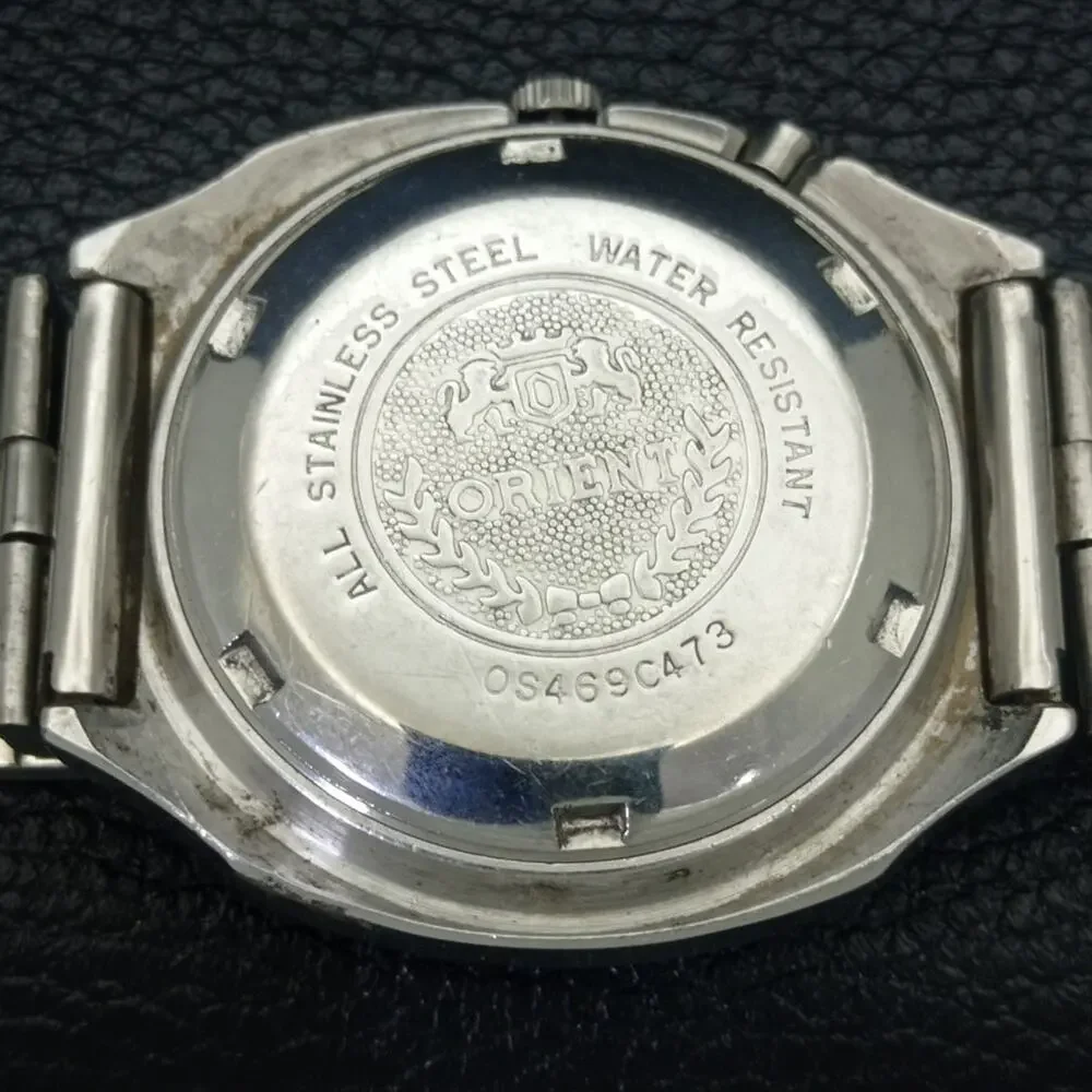 Vintage 1975 Ricoh Automatic Mens Silver Watch W/daydate & Gold accents